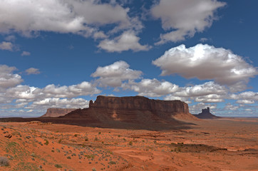 Monument Valley National Park with clouds and blue sky