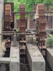 water mill with three wheels in the Lombard countryside. Italy