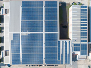 Aerial View of Solar Panel on Factory Rooftop, Solar energy electric panels creation on a storage building