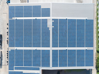 Aerial View of Solar Panel on Factory Rooftop, Solar energy electric panels creation on a storage building