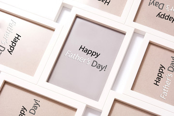 Happy Father's Day words on frames background 
