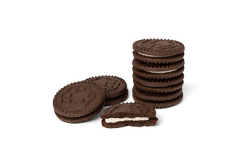 Chocolate cookies with milk filling isolated on white background.