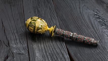  royal scepter on a black background