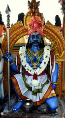 Blue statue of gate guardian at Hindu temple