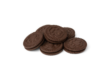 Chocolate cookies with milk filling isolated on white background.