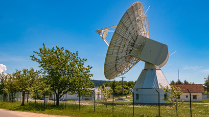 Big radio telescope behind a fence near Bad Kötzting - Bavarian forest - Bavaria - Germany