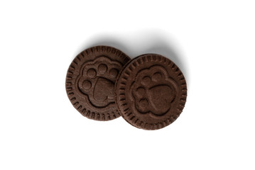 Chocolate cookies with milk filling isolated on white background.