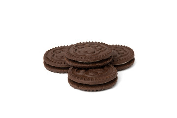 Chocolate cookies with milk filling isolated on white background.