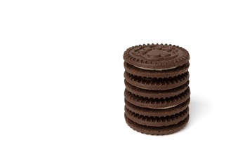 Chocolate cookies with milk filling isolated on white background.