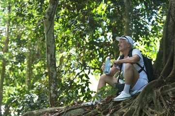 Portrait of elderly man in tropical forest