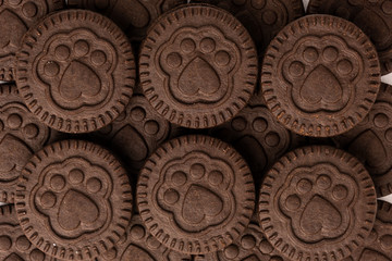 Chocolate cookies with milk filling isolated on white background.