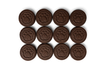 Chocolate cookies with milk filling isolated on white background.
