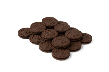 Chocolate cookies with milk filling isolated on white background.