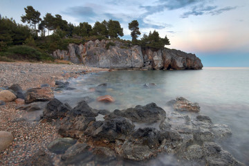 Fototapeta na wymiar Isolated beach in kassandra peninsula of Halkidiki during golden hour