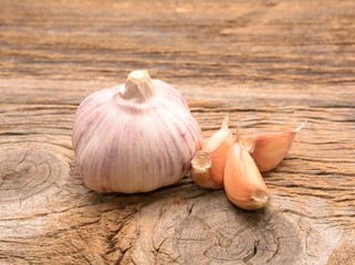 Fresh garlic on wooden background. Still life with raw vegetable