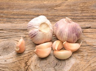 Fresh garlic on wooden background. Still life with raw vegetable