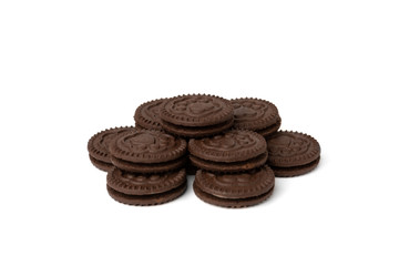 Chocolate cookies with milk filling isolated on white background.