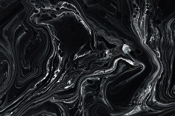 Abstract black marble texture background. Oil, acrylic paint mix pattern.