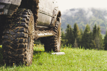 Dirty cars and wheels in the mountains. Swamp on the tires. Trips offroad across Ukraine. View of...
