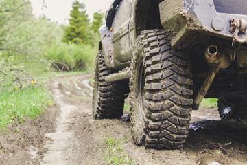 Dirty cars and wheels in the mountains. Swamp on the tires. Trips offroad across Ukraine. View of the Carpathian Mountains.