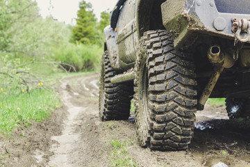 Dirty cars and wheels in the mountains. Swamp on the tires. Trips offroad across Ukraine. View of the Carpathian Mountains.