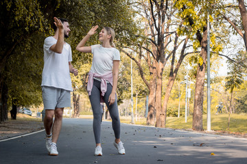 Young couples jogging in the park.