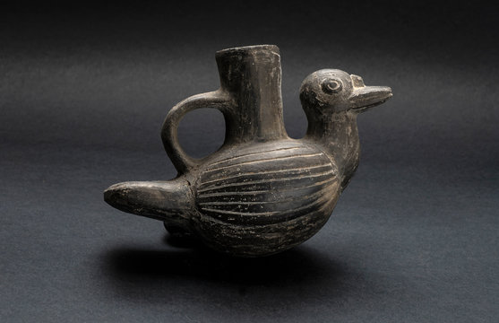 Pre-columbian animal-shaped ceramic called "Huaco" from unidentified ancient Peruvian culture. Pre inca handcrafted pottery piece made by ancient civilization.