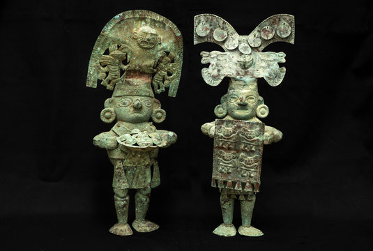 Pre-columbian copper men figure from Lambayeque ancient Peruvian culture. Pre inca handcrafted metallic piece made by ancient civilization.
