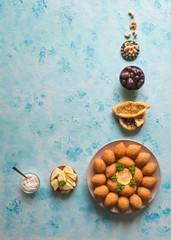 Fototapeta na wymiar Lebanese Kibbeh, Stuffed Meatballs Food. Fried bulgur and meat balls