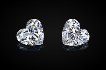 Diamond isolated on black background. Luxury colorless transparent sparkling gemstone diamond heart shape cut