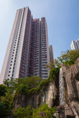 Big residential building in Hong Kong and waterfall