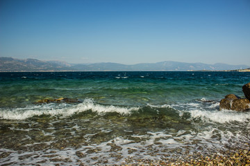 Aegean sea wavy waterfront scenic landscape shoreline 