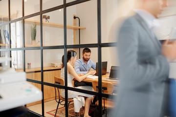 Blurred motion of businessman hurry up to the meeting with business people working in team at the...