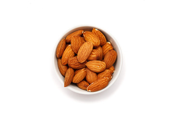 Almond in ceramic bowl on a white background
