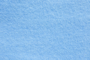Background texture of blue pattern knitted fabric made of cotton or wool. close up