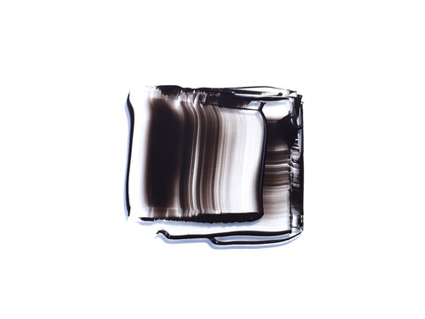 Black liquid smeared into square shapes