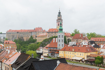 Naklejka na ściany i meble Panoramic landscape view of the historic city of Cesky Krumlov with famous Cesky Krumlov Castle, Church city is on a UNESCO World Heritage Site captured during spring with nice sky and clouds