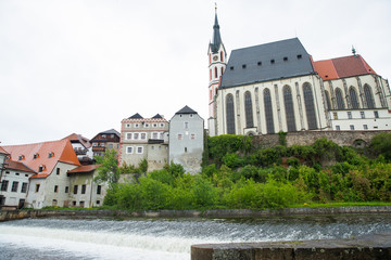 Panoramic landscape view of the historic city of Cesky Krumlov with famous Church city is on a UNESCO World Heritage Site captured during spring with nice sky and clouds