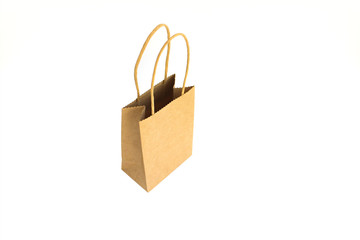 Opend brown paper shopping bag with hands isolated on white background