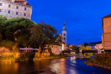 Obraz premium Vltava river long exposure night shot of the historic city of Cesky Krumlov with famous Cesky Krumlov Castle, Church city is on a UNESCO World Heritage Site