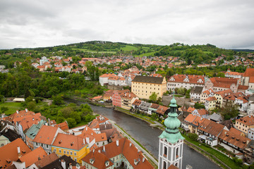 Obraz premium Panoramic landscape view above from aerial of the historic city of Cesky Krumlov with famous Cesky Krumlov Castle, Church city is on a UNESCO World Heritage Site captured during the spring