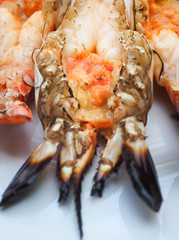 Grilled big tiger shrimps prawns on Plate. Roasted barbecue shrimp.