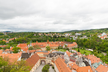 Fototapeta na wymiar Panoramic landscape view above from aerial of the historic city of Cesky Krumlov with famous Cesky Krumlov Castle, Church city is on a UNESCO World Heritage Site captured during the spring