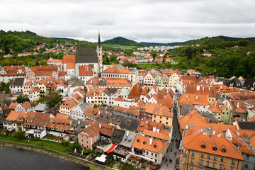 Fototapeta premium Panoramic landscape view above from aerial of the historic city of Cesky Krumlov with famous Cesky Krumlov Castle, Church city is on a UNESCO World Heritage Site captured during the spring