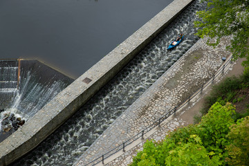View of the Vltava River flowing through the town of Cesky Krumlov with the famous Cesky Krumlov Castle, Church of the World Heritage Site.