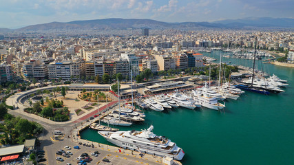 Fototapeta premium Aerial panoramic view of famous port of Piraeus one of the largest and busiest in Mediterranean sea where passenger ships travel to Aegean destinations, Attica, Greece
