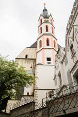 Panoramic landscape view on Castle in the historic city of Cesky Krumlov with famous Church city is on a UNESCO World Heritage Site captured during spring with nice sky and clouds
