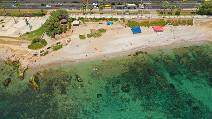 Aerial panoramic photo of famous seaside bay of Faliro with beautiful emerald sea, clouds and deep blue sky