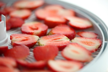 Strawberry berries cut dry plastic grid dryers