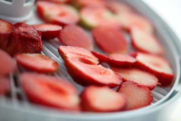 Strawberry berries cut dry plastic grid dryers